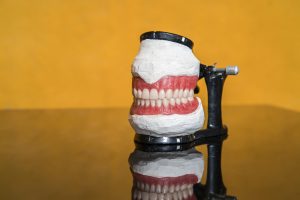 مجله سلامت 4 20230911183949 fpdl.in model teeth dentists explain various tooth diseases problems yellow background 151992 903 full